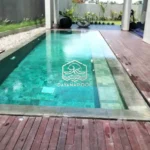 kolam renang overflow dengan finishing batu alam sukabumi