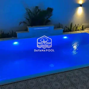 kolam renang dengan lampu biru di malam hari