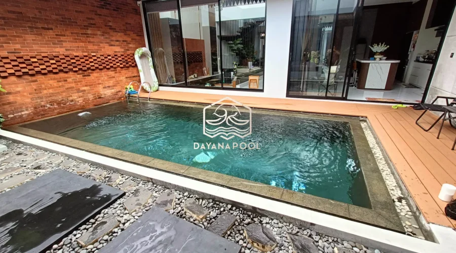 kolam renang dengan finishing batu andesit